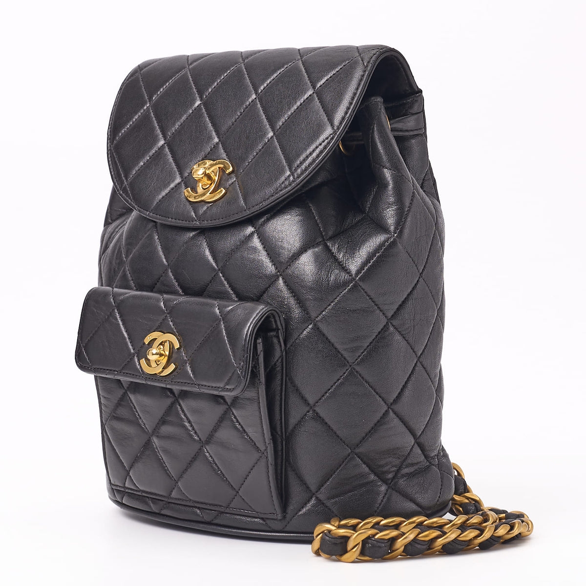 Gebrauchte Rucksacktasche mit Kette, Matelassé-Außenklappe, Drehverschluss, Lammleder, schwarz, goldfarbene Hardware, gebraucht